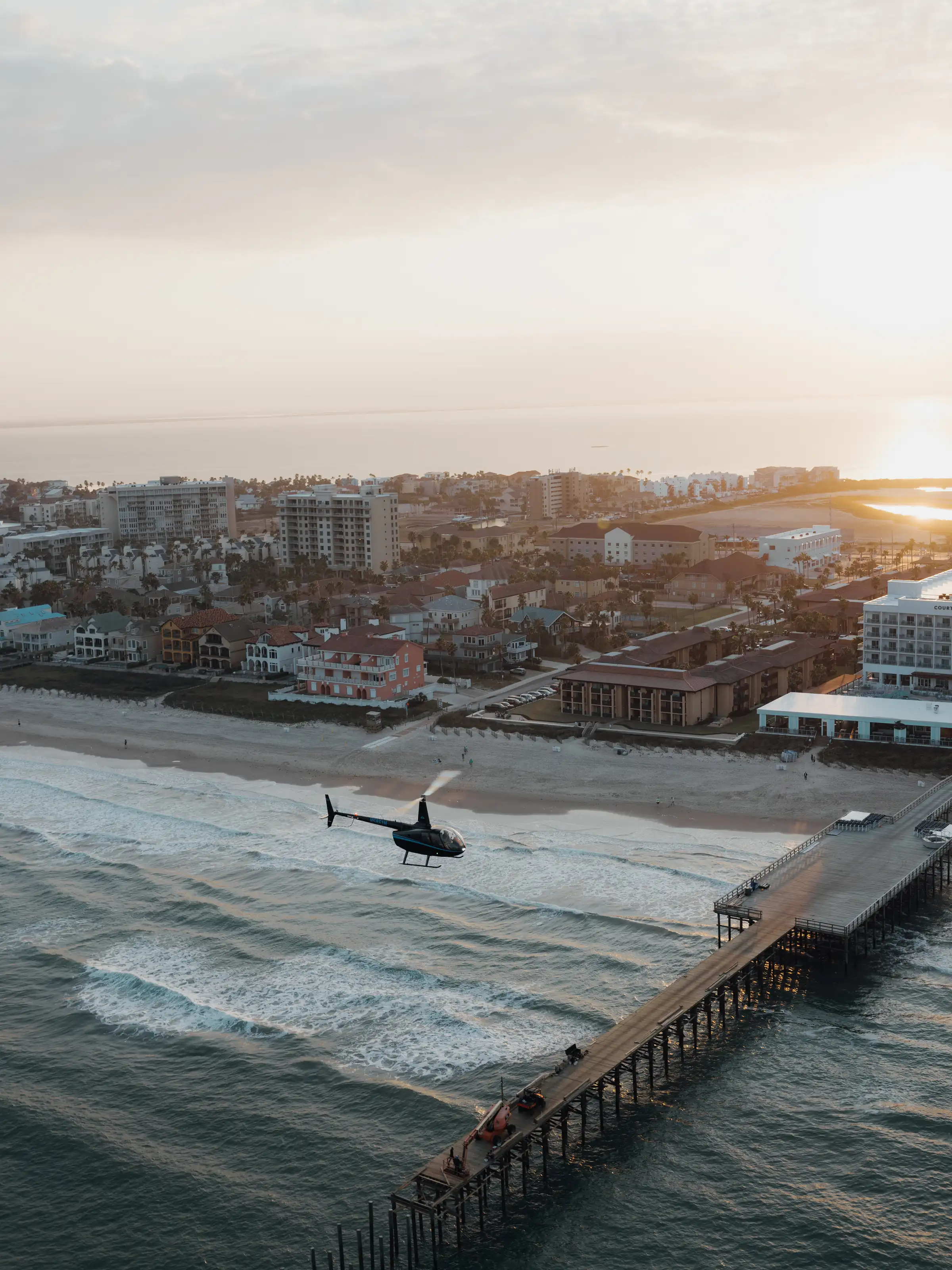 Aerial of a fishing pier at sunset