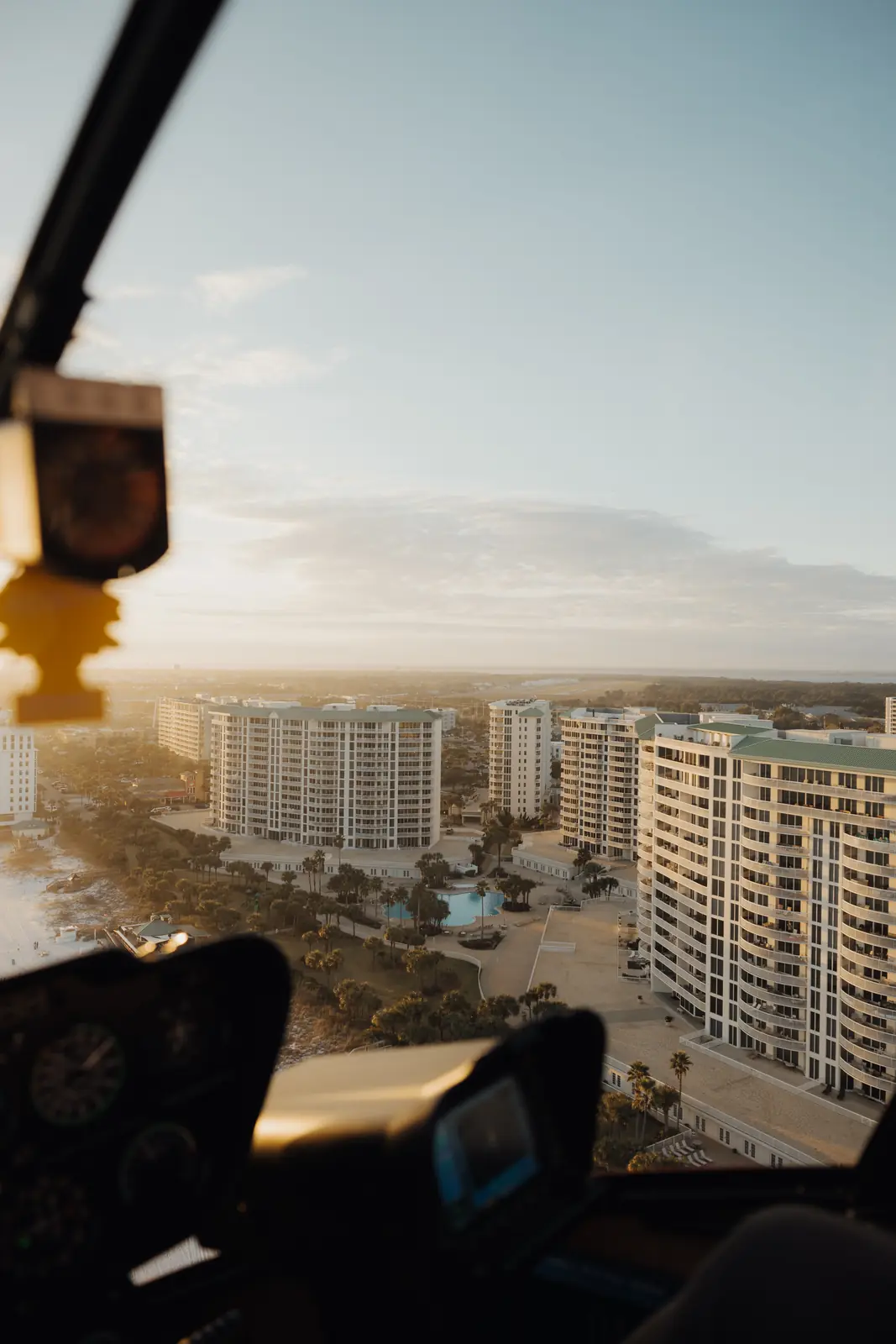 View from a helicopter over beachfront towers
