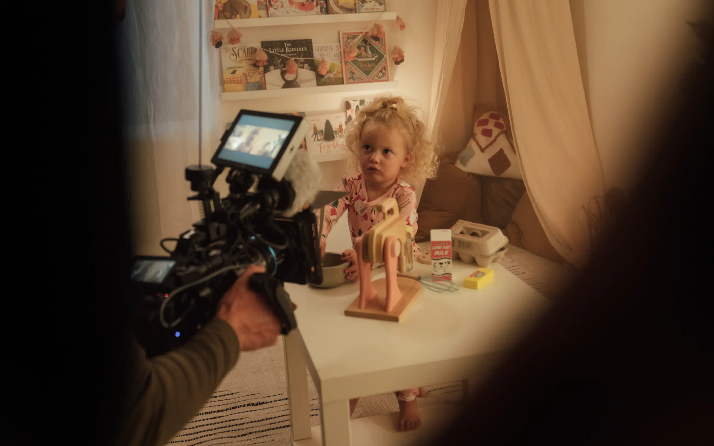 Camera rolling on a cozy indoor family session