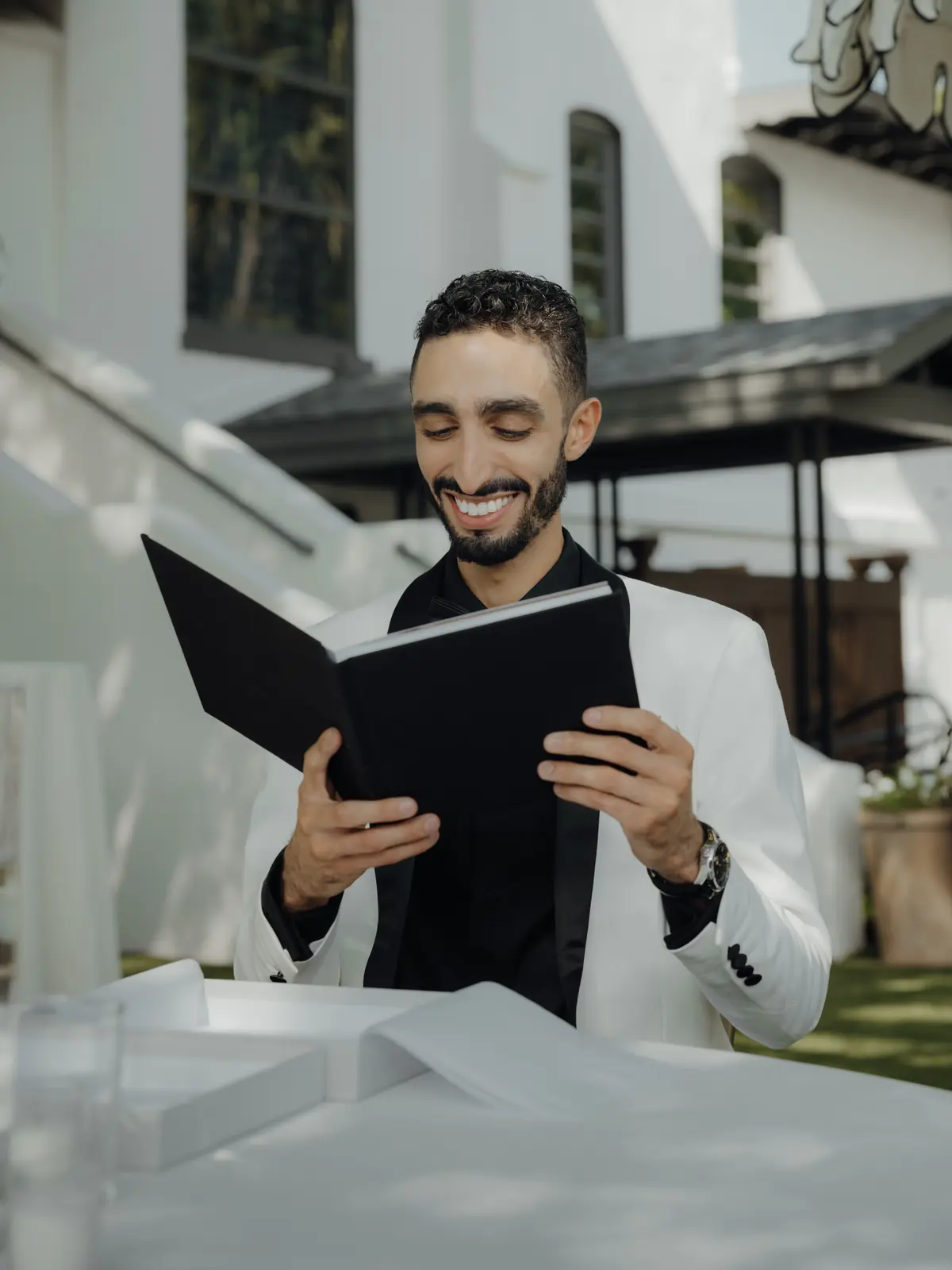 Officiant smiling while reading during the ceremony